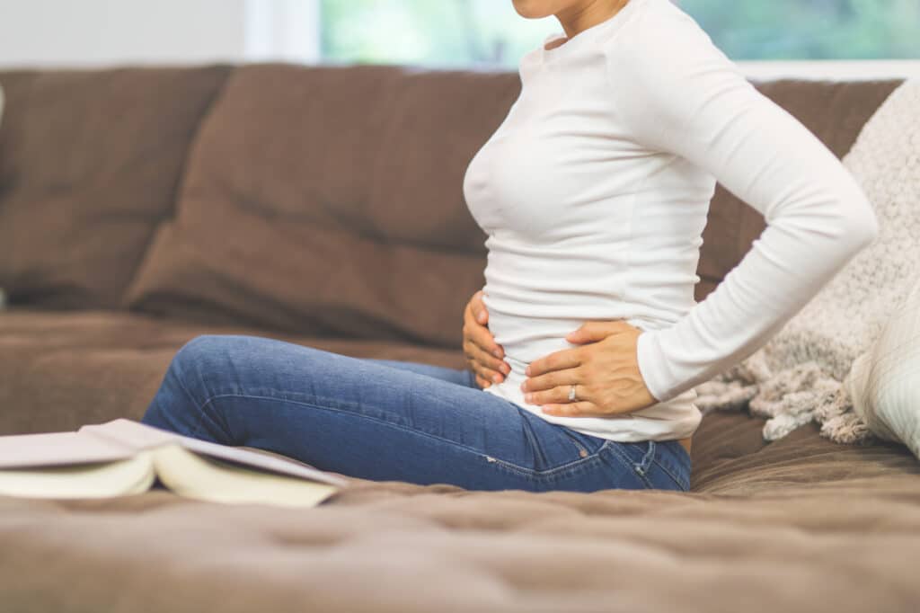 Woman experiencing pelvic pain from a possible femoral hernia.